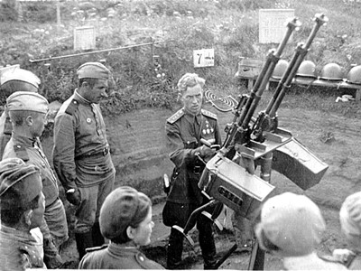 A meeting of servicewomen of the 22nd Anti-Aircraft Machine Gun Regiment of the Moscow Air Defense Front with the Hero of the Soviet Union, pilot G.A. Grigoryev. [not earlier than 1943]. Moscow region. Perm City Archive.