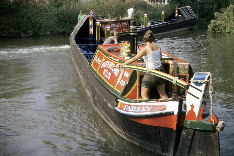Working narrowboat and butty leaving the Oxford Canal en route to the River Thames  along the Sheepwash Channel