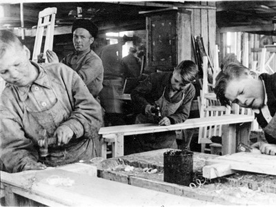 Members of the leading youth brigade of the Krasny Oktyabr Timber Plant at work.