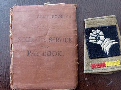 Soldier’s Service and Pay Book and a cloth badge of the 6th Armoured Division.
