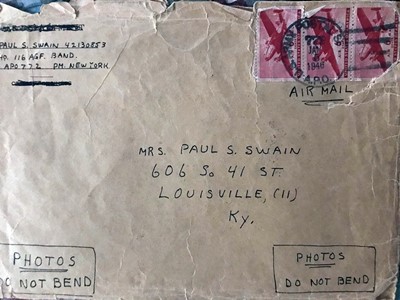 An envelope with photos sent home by air mail.