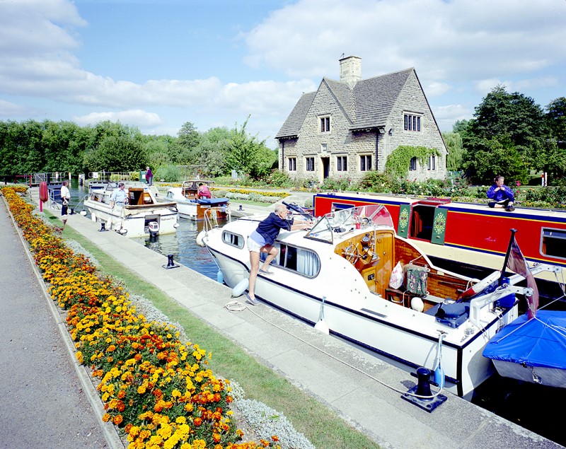 Three river craft and a canal narrowboat in Iffley Lock, a little downstream of the city, 1993