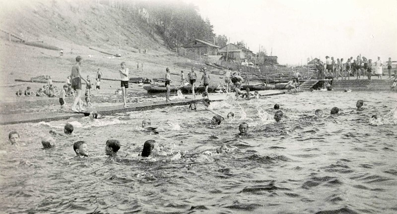 Children swimming in a fenced-off bathing place